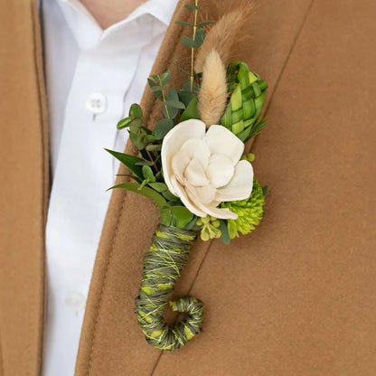 BoutStix magnetic boutonniere on a brown coat with a white shirt